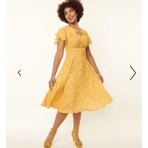 Unique Vintage Yellow & white floral swing dress